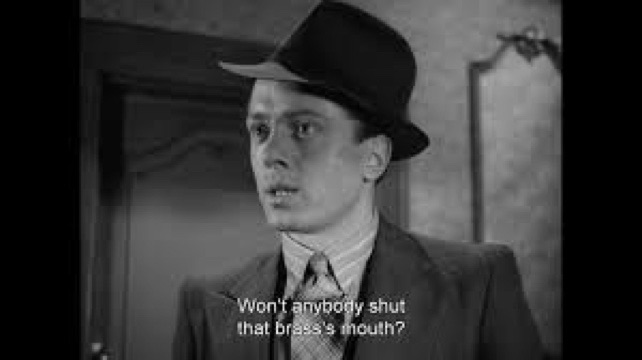 A very young Richard Attenborough as Pinkie says "won't anybody shut that brass's mouth" in a still from Brighton Rock (1947)